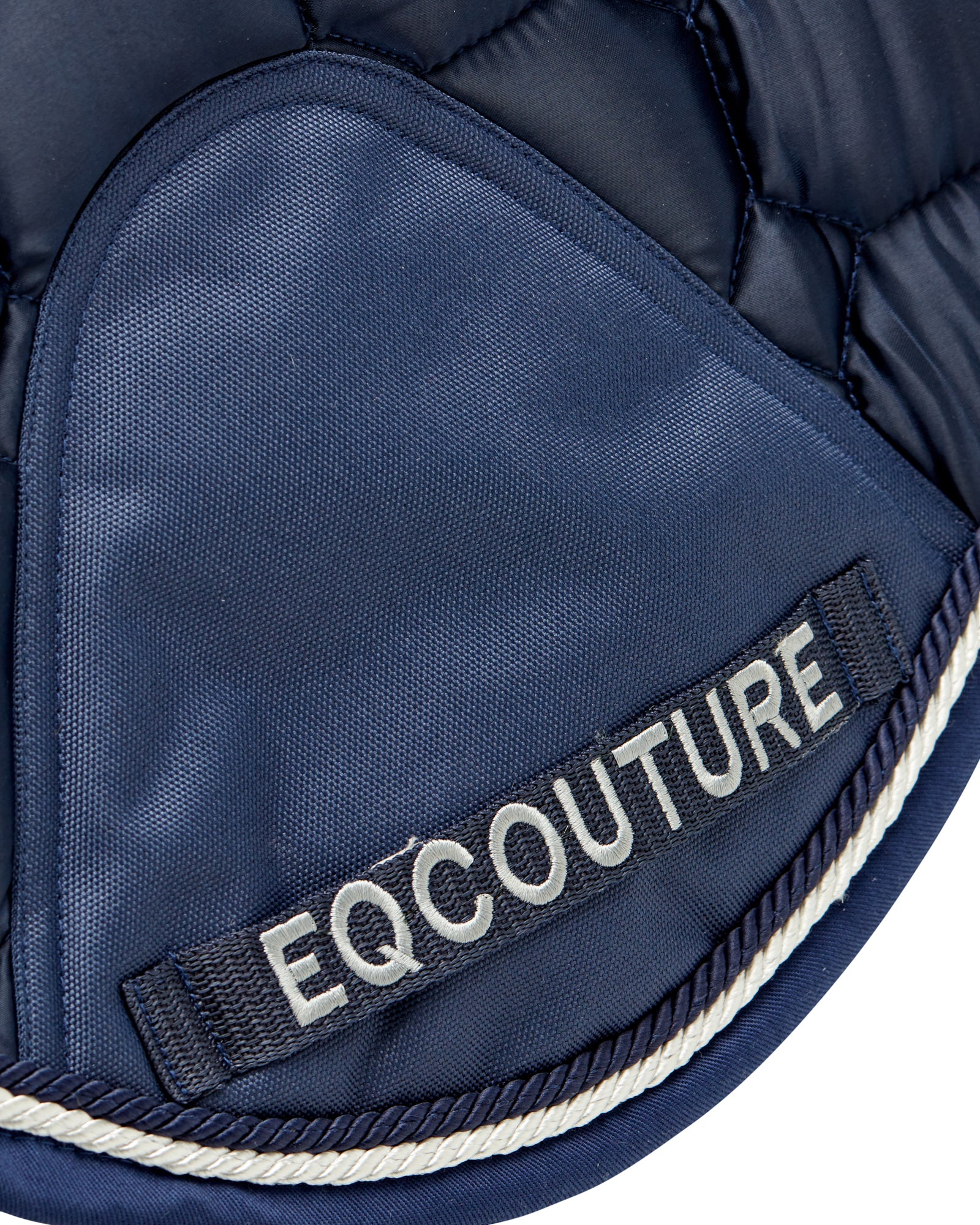 Equestrian luxury quilted navy satin jumping cut saddle pads/numnahs.