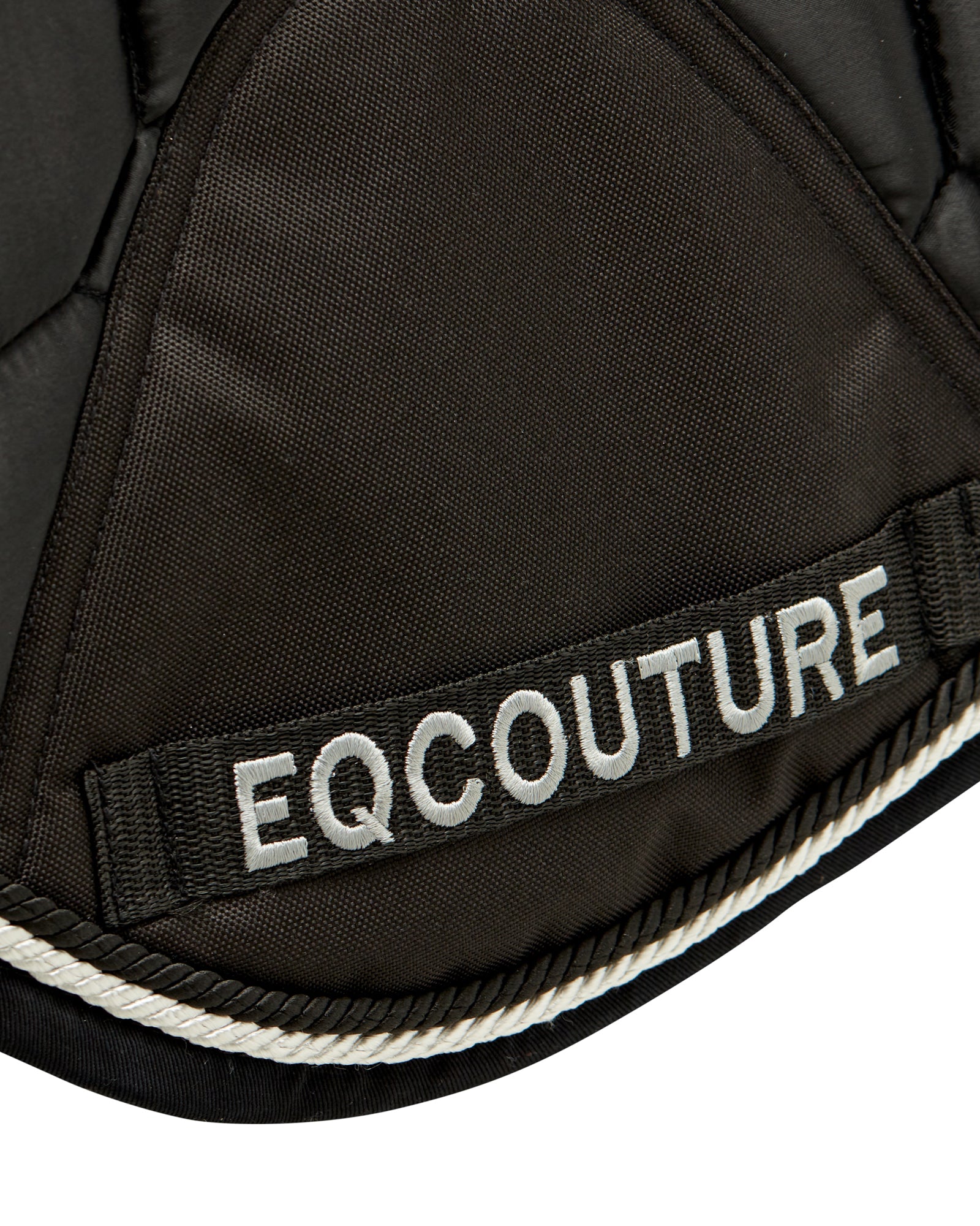 Equestrian luxury quilted black satin jumping cut saddle pads/numnahs.