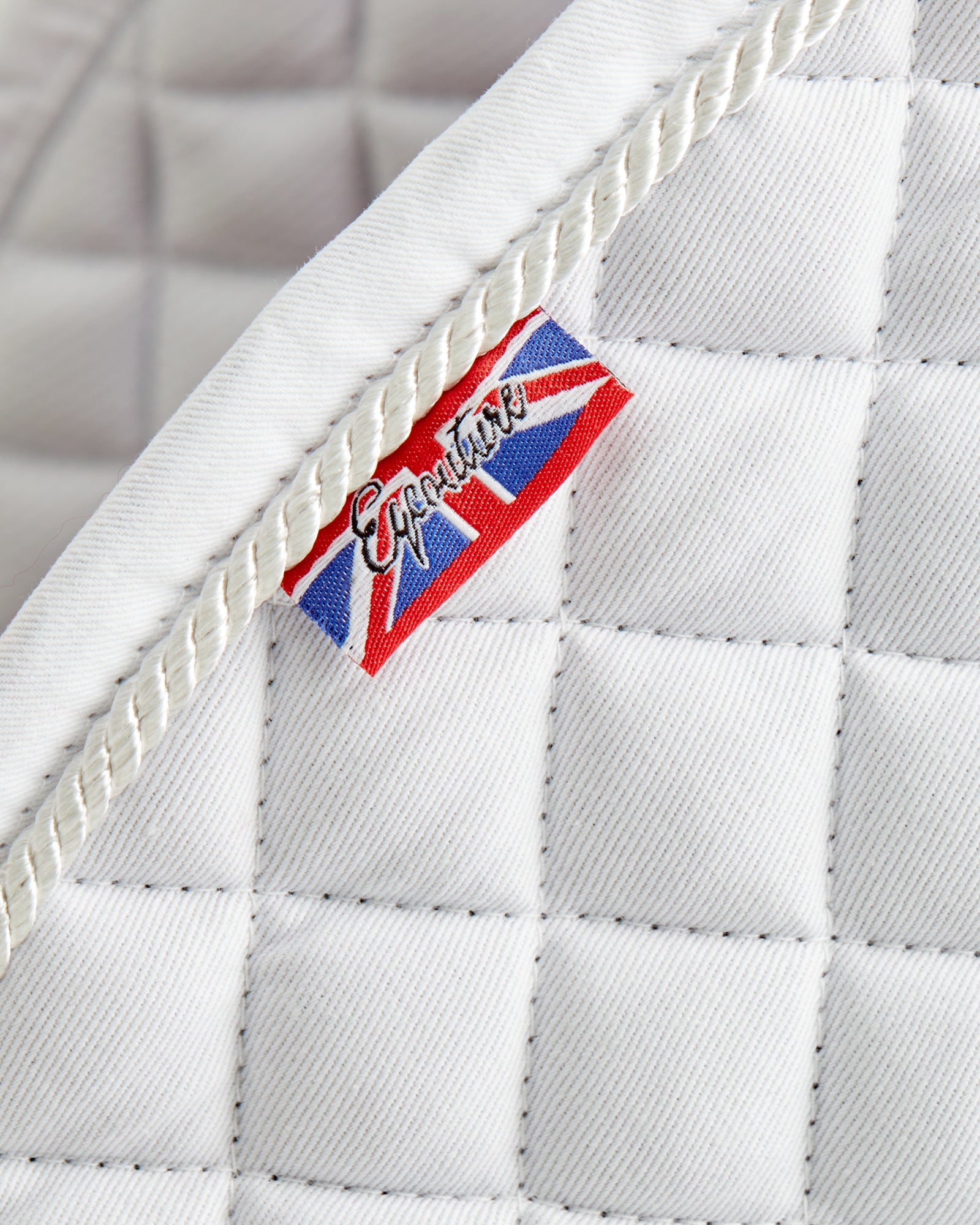 Equestrian white competition quilted jumping saddle pad/numnahs.
