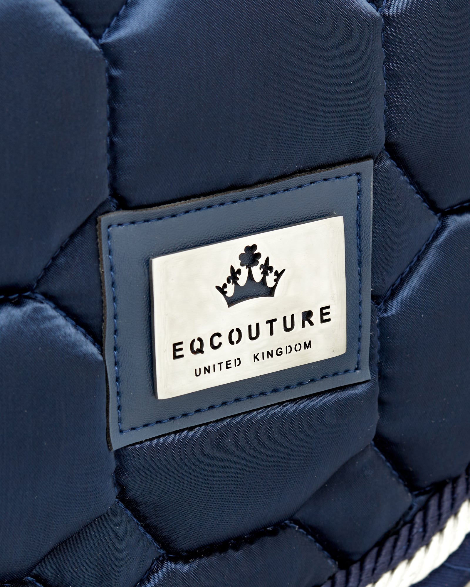 Equestrian luxury quilted navy dressage cut saddle pads/numnahs.