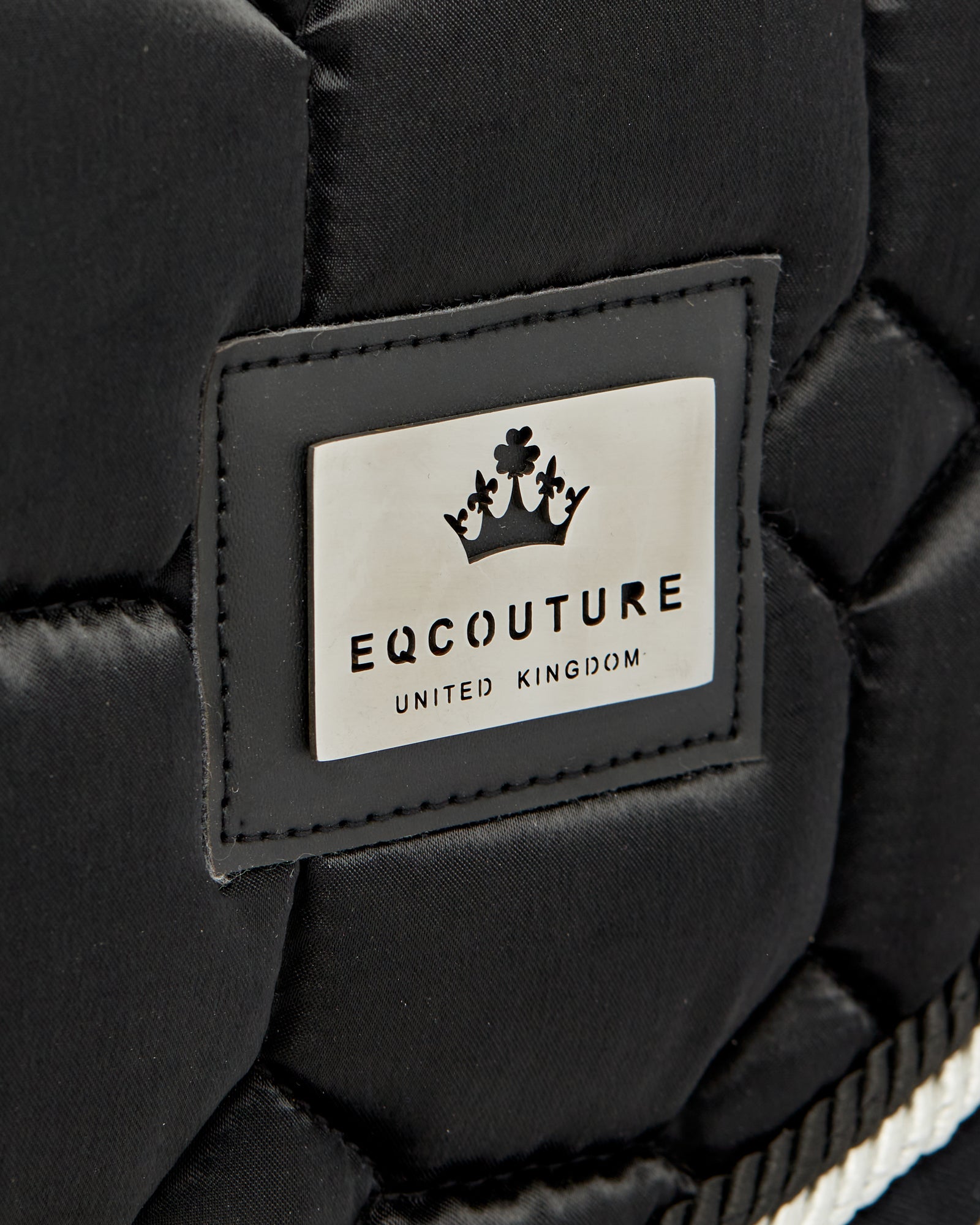 Equestrian luxury quilted black satin jumping cut saddle pads/numnahs.