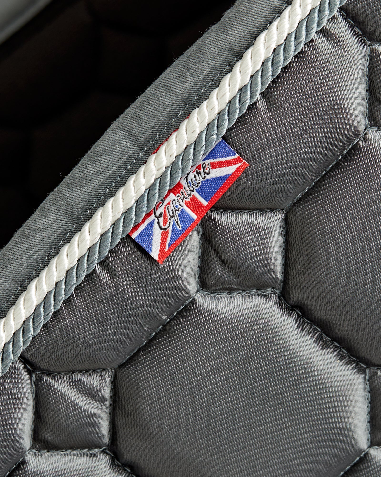 Equestrian luxury quilted grey satin jumping cut saddle pads/numnahs.