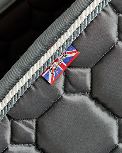 Equestrian luxury quilted grey satin jumping cut saddle pads/numnahs.