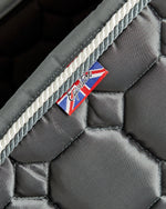 Load image into Gallery viewer, Equestrian luxury quilted Grey satin dressage cut saddle pads/numnahs.
