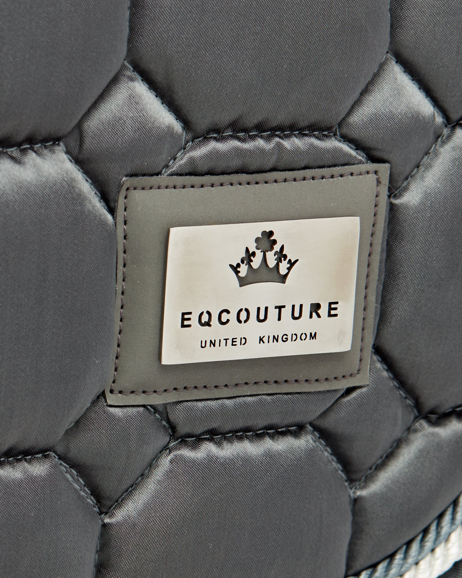 Equestrian luxury quilted grey satin jumping cut saddle pads/numnahs.
