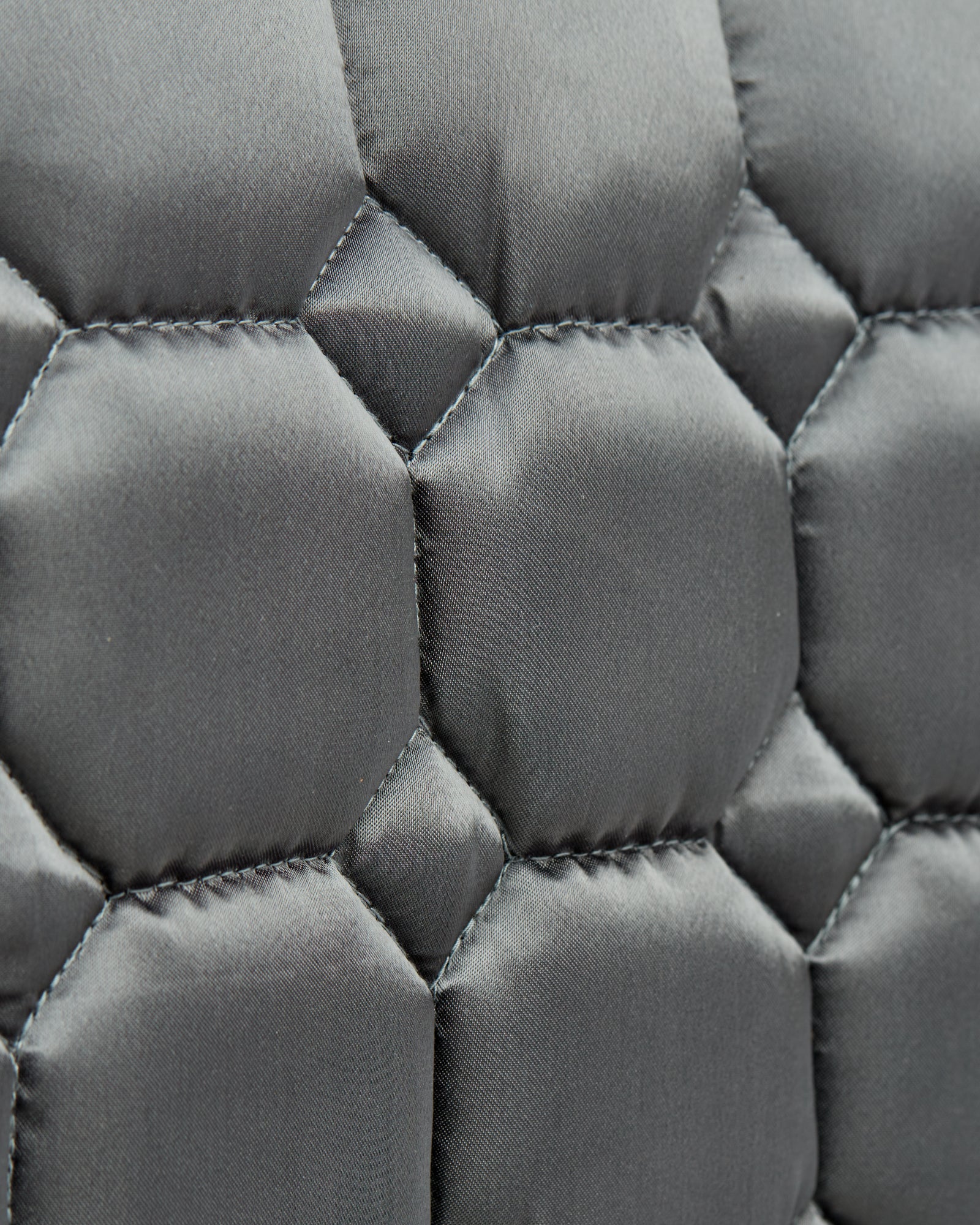 Equestrian luxury quilted grey satin jumping cut saddle pads/numnahs.